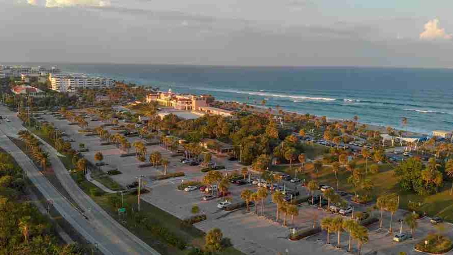 The Lake Worth Beach oceanfront and casino building at dusk, seen from the air