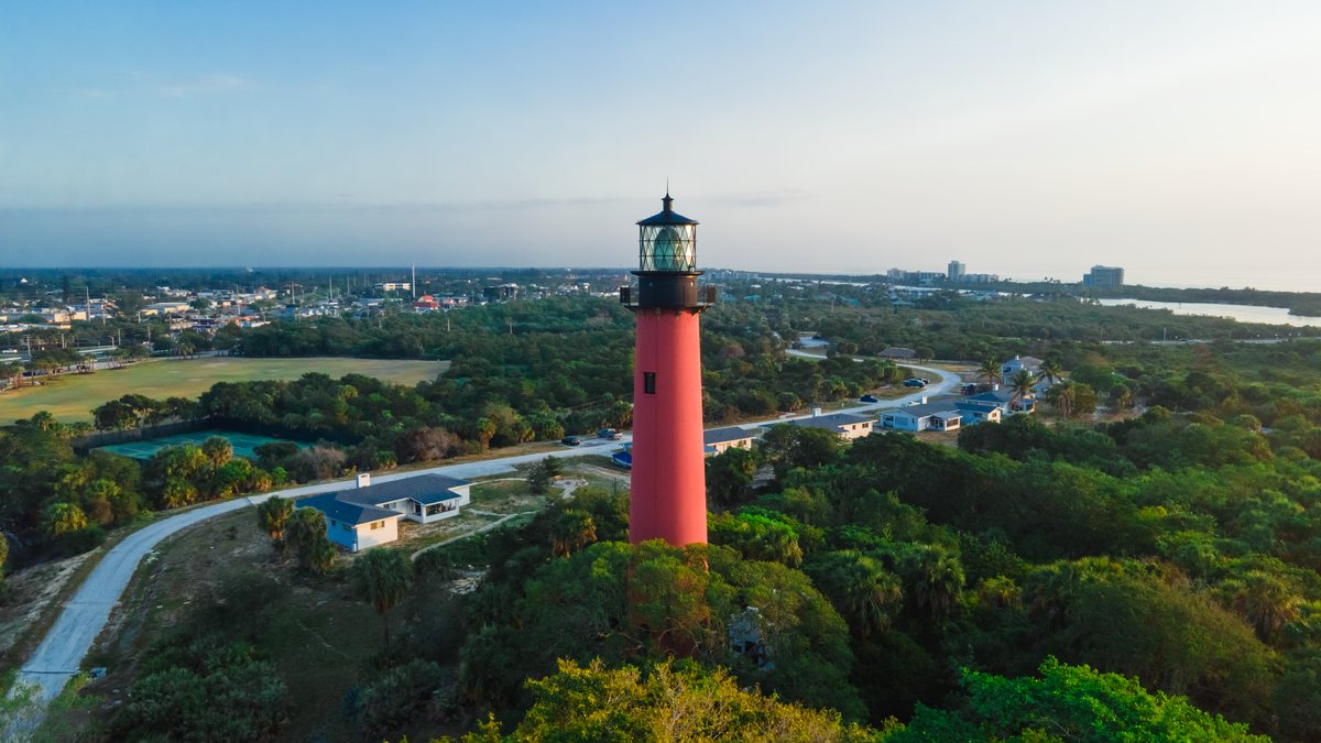 The Jupiter Inlet Lighthouse from the air, red against the green of the inlet park